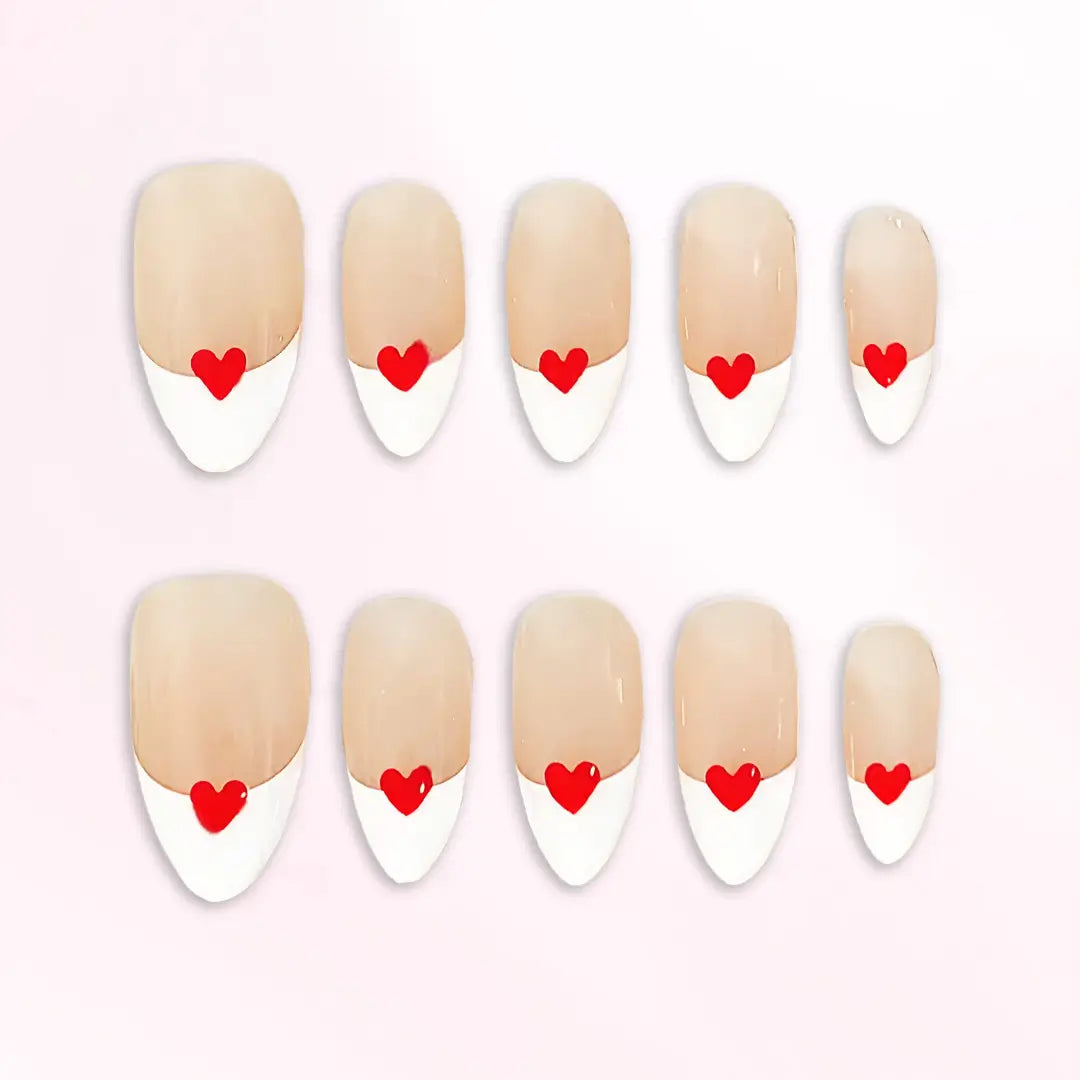 Soft nude-based Crimson Accent nail set with clean white tips reflecting elegance and brightness